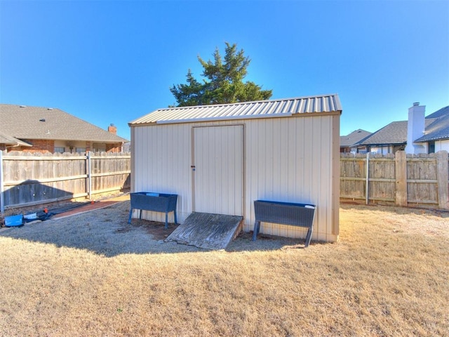 view of shed featuring a fenced backyard