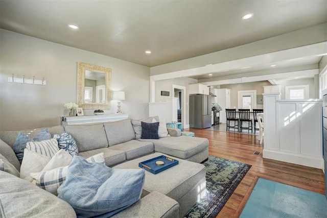 living room featuring recessed lighting and wood finished floors