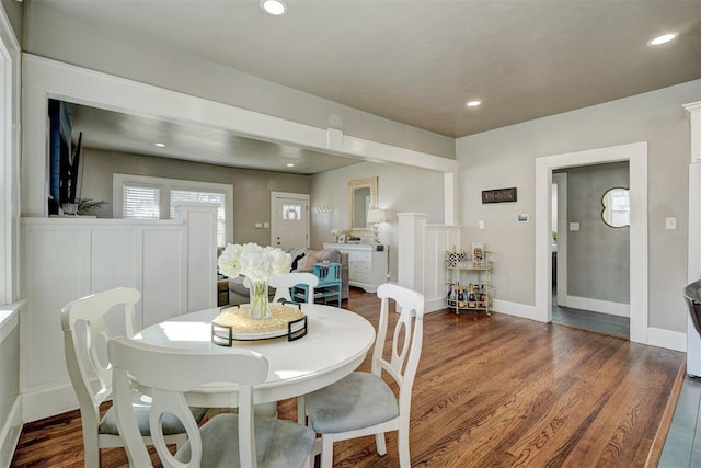 dining space with dark wood-type flooring, recessed lighting, and baseboards