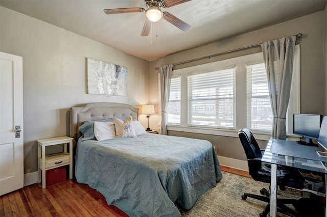 bedroom with wood finished floors, baseboards, and ceiling fan