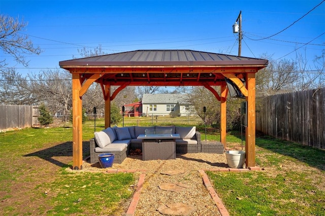 view of patio / terrace featuring a gazebo, an outdoor hangout area, and a fenced backyard