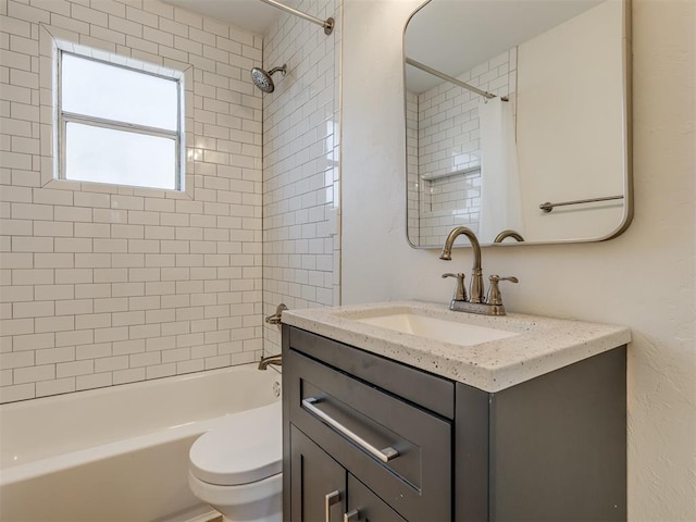 bathroom with vanity, toilet, and washtub / shower combination