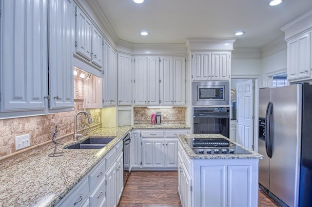 kitchen featuring white cabinetry, black appliances, crown molding, and a sink