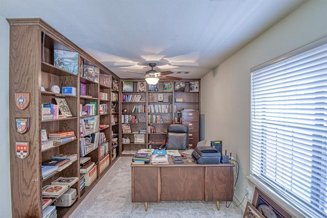 office area featuring carpet flooring and a ceiling fan