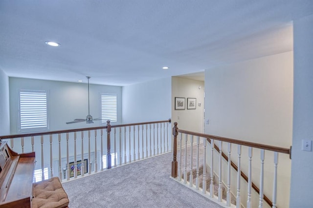 hall with recessed lighting and carpet