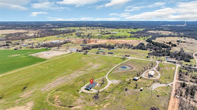 birds eye view of property featuring a rural view