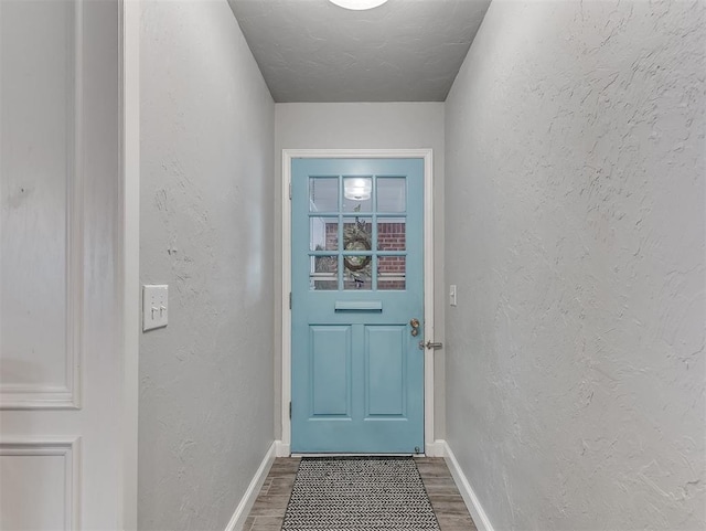 4303 N Redmond Ave, Bethany, OK 73008 - entryway featuring dark wood-style flooring and a textured wall