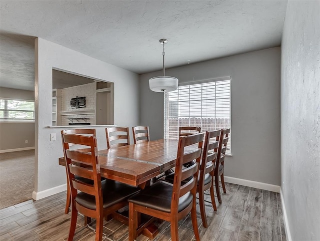4303 N Redmond Ave, Bethany, OK 73008 - dining area with wood finished floors and a textured ceiling