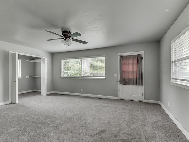 4303 N Redmond Ave, Bethany, OK 73008 - unfurnished bedroom featuring carpet floors and ceiling fan