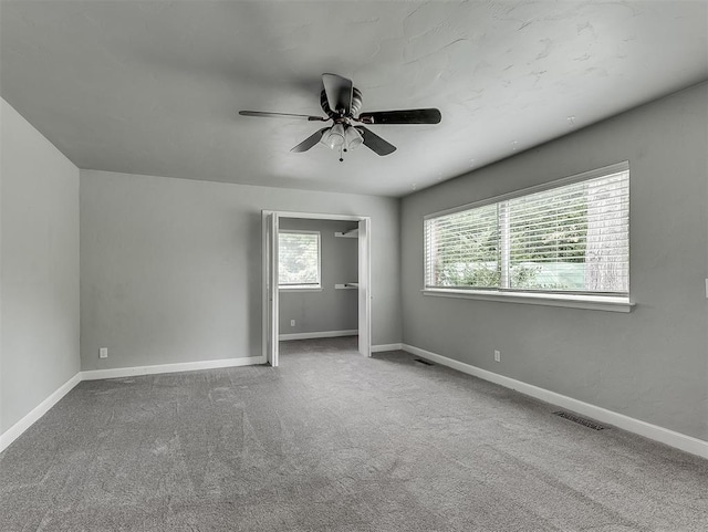 4303 N Redmond Ave, Bethany, OK 73008 - unfurnished bedroom featuring carpet flooring and ceiling fan