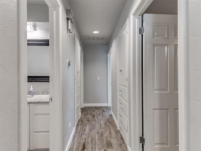 4303 N Redmond Ave, Bethany, OK 73008 - corridor with light wood-type flooring and baseboards