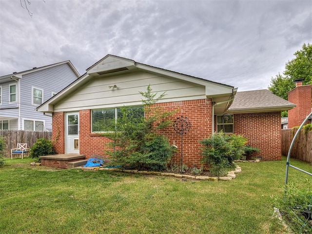 4303 N Redmond Ave, Bethany, OK 73008 - rear view of property featuring brick siding
