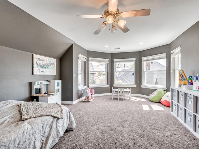 carpeted bedroom with baseboards, visible vents, and ceiling fan