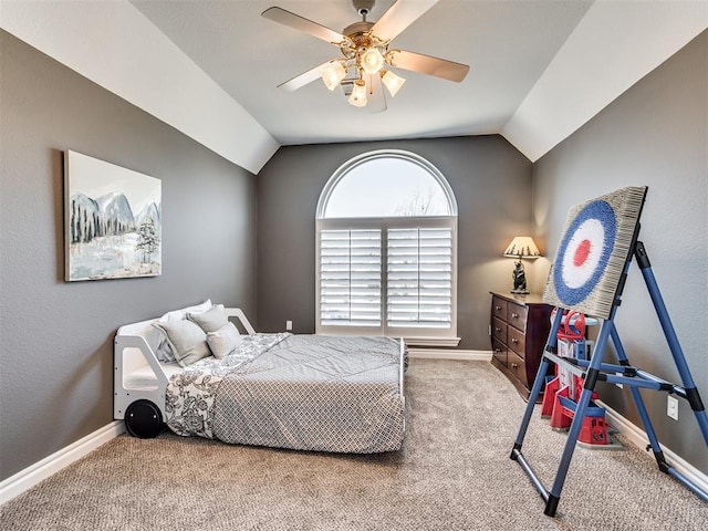 bedroom featuring baseboards, carpet flooring, and vaulted ceiling