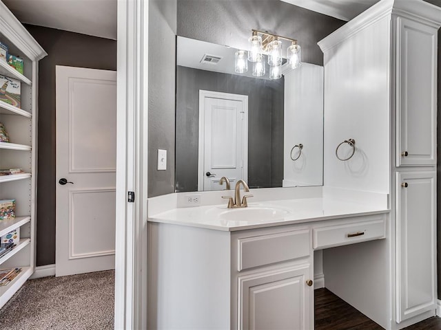 bathroom featuring visible vents and vanity