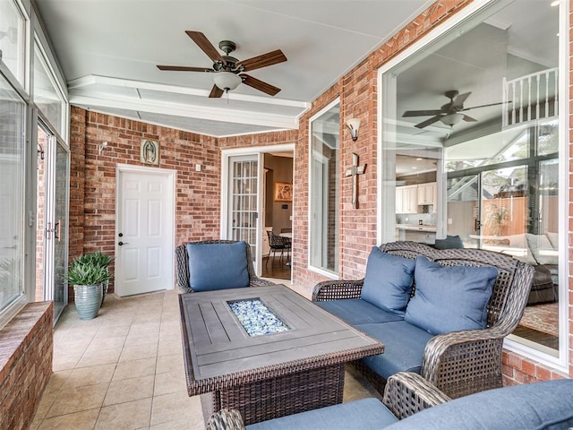 sunroom / solarium with ceiling fan