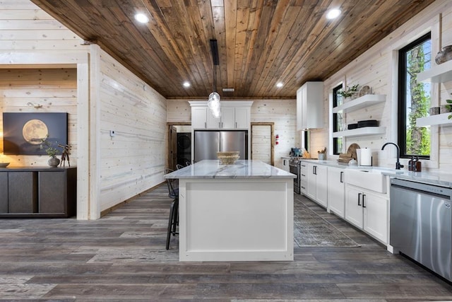 kitchen with open shelves, stainless steel appliances, a kitchen island, and wooden ceiling