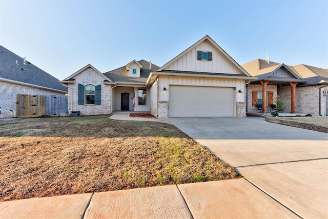 view of front of property with brick siding, board and batten siding, fence, concrete driveway, and an attached garage