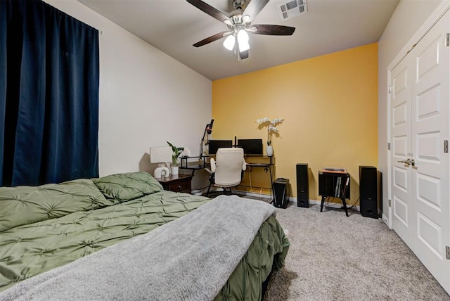 bedroom featuring a ceiling fan, baseboards, visible vents, and carpet floors