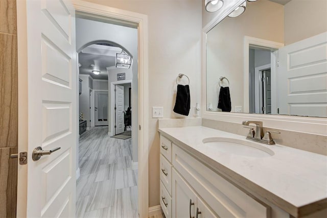 bathroom featuring vanity and baseboards