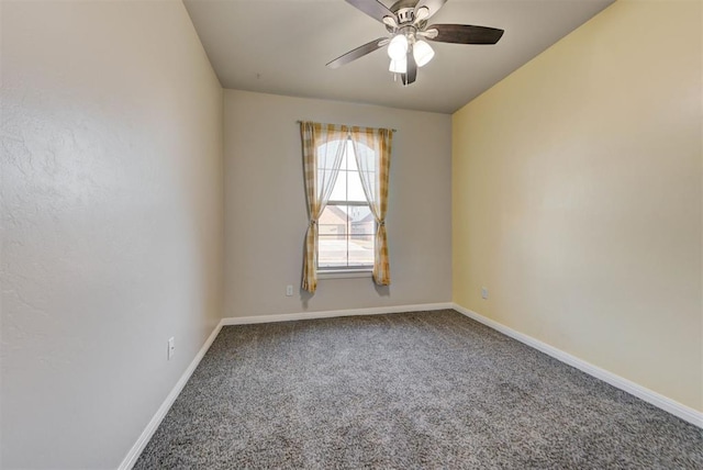 spare room featuring baseboards, ceiling fan, and carpet flooring