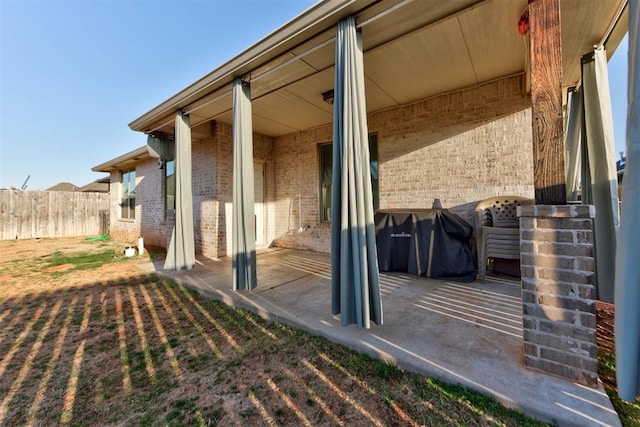 view of patio / terrace featuring fence