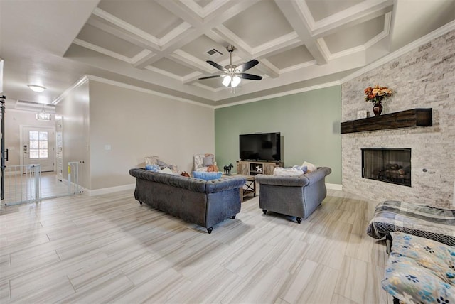 living room with visible vents, crown molding, a fireplace, coffered ceiling, and a ceiling fan