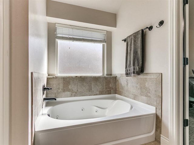 bathroom featuring a tub with jets