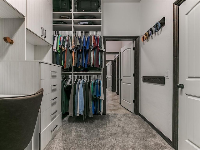 walk in closet featuring carpet floors