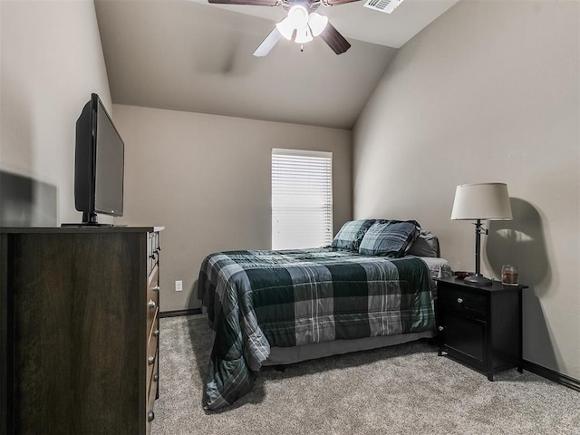 bedroom with visible vents, light carpet, baseboards, and vaulted ceiling