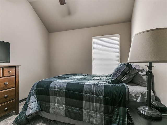 bedroom featuring lofted ceiling, carpet floors, and ceiling fan