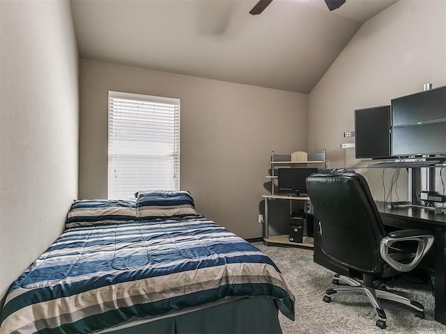 carpeted bedroom featuring a ceiling fan and vaulted ceiling