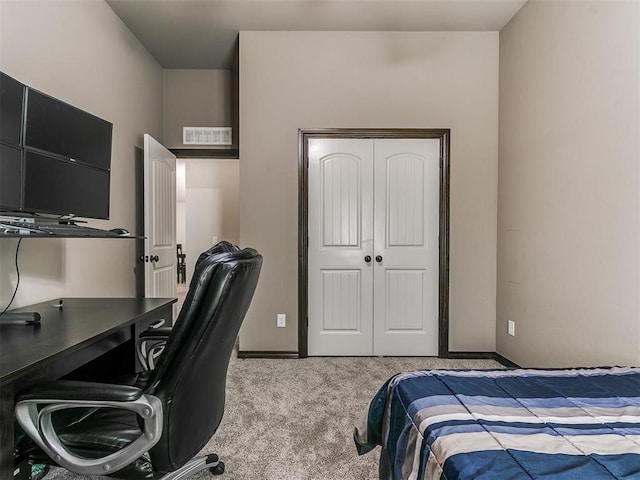 bedroom with visible vents, baseboards, a closet, and carpet flooring