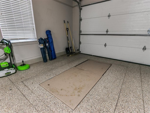 garage featuring baseboards