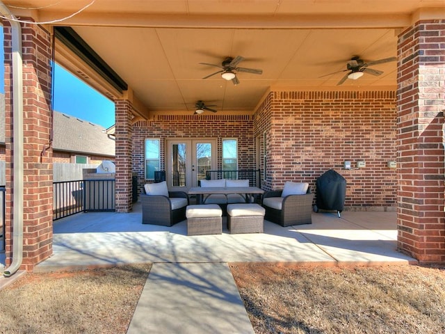 view of patio / terrace featuring area for grilling, ceiling fan, outdoor lounge area, and fence