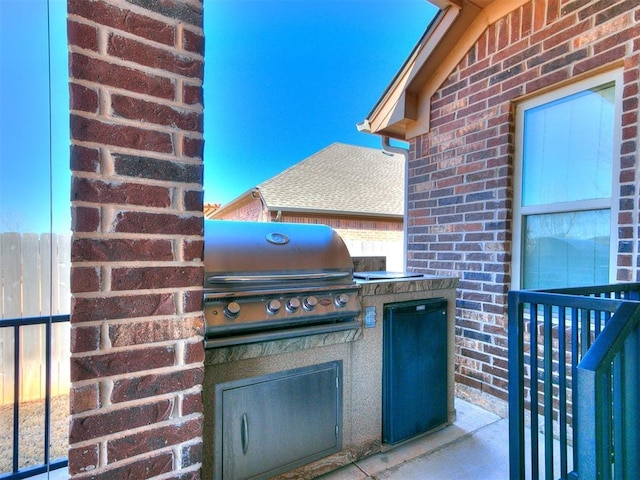 view of patio with grilling area and exterior kitchen