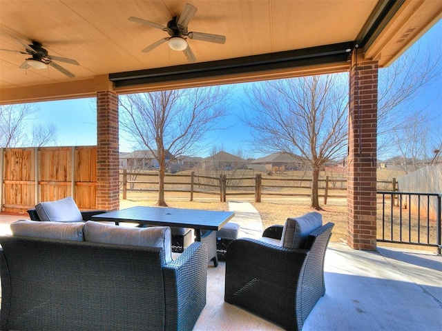 view of patio featuring a ceiling fan, a fenced backyard, and outdoor lounge area