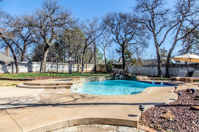 view of swimming pool with an in ground hot tub, a fenced backyard, a fenced in pool, and a patio area