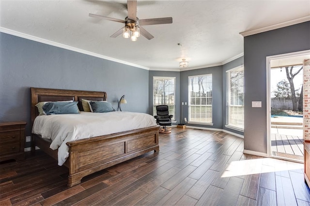 bedroom featuring dark wood-style floors, ornamental molding, and access to outside