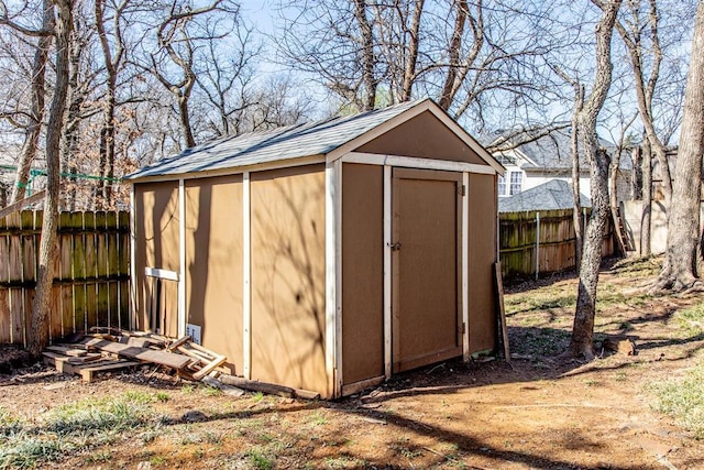 view of shed with a fenced backyard