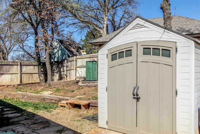 view of shed featuring a fenced backyard