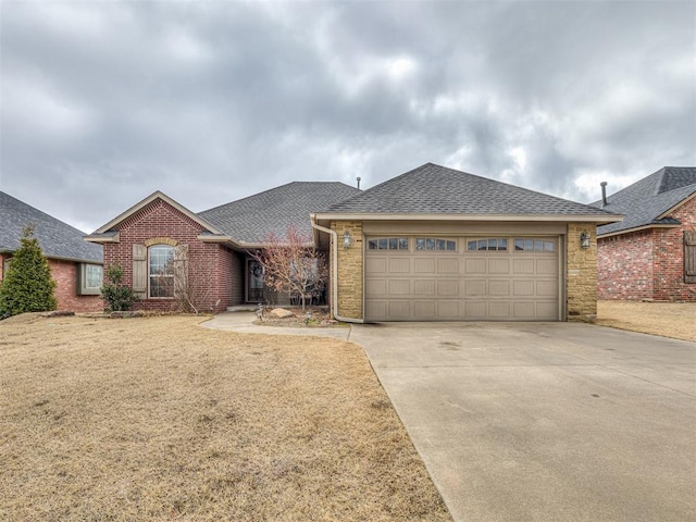 ranch-style house with a garage, brick siding, concrete driveway, and a shingled roof