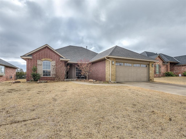 ranch-style home with brick siding, an attached garage, driveway, and roof with shingles