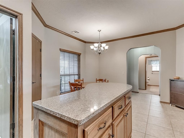 kitchen with visible vents, a textured ceiling, arched walkways, light tile patterned floors, and a chandelier