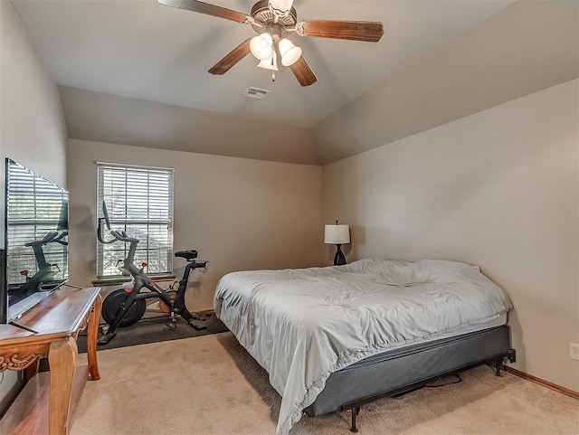 carpeted bedroom featuring visible vents, ceiling fan, baseboards, and lofted ceiling