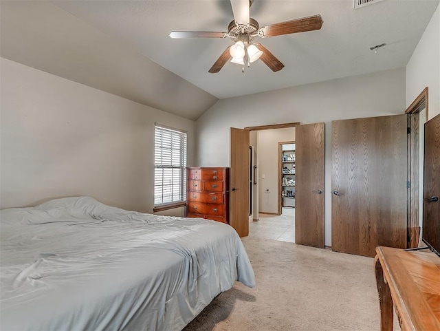 bedroom with light colored carpet, a ceiling fan, and lofted ceiling