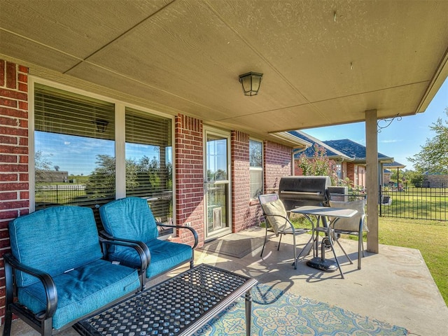 view of patio / terrace featuring area for grilling and fence