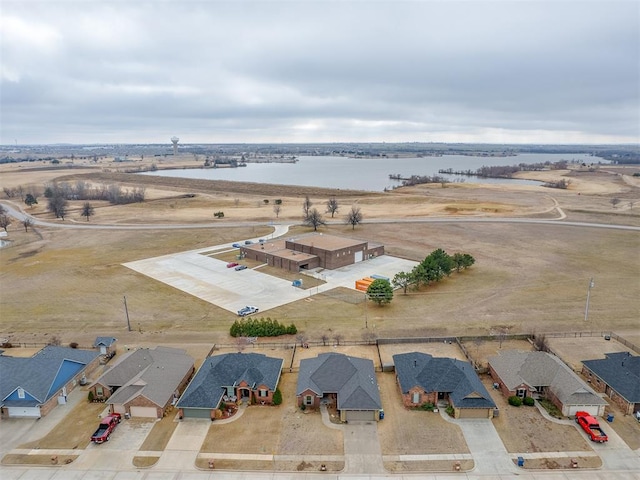 birds eye view of property featuring a residential view and a water view