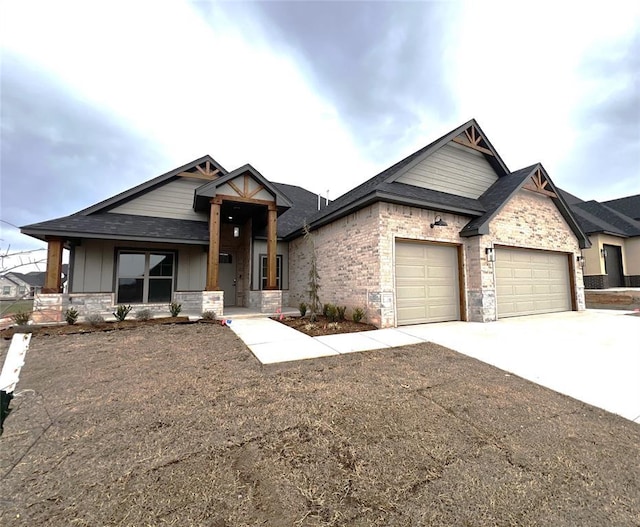 craftsman inspired home featuring brick siding, board and batten siding, concrete driveway, and an attached garage