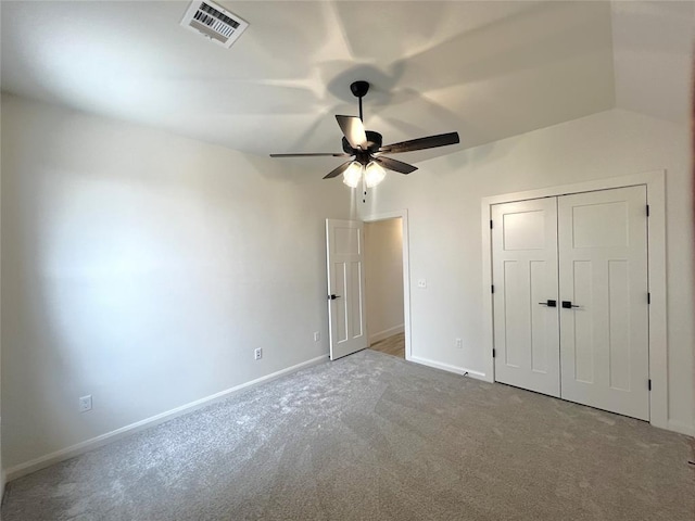 unfurnished bedroom with a ceiling fan, baseboards, visible vents, carpet floors, and a closet